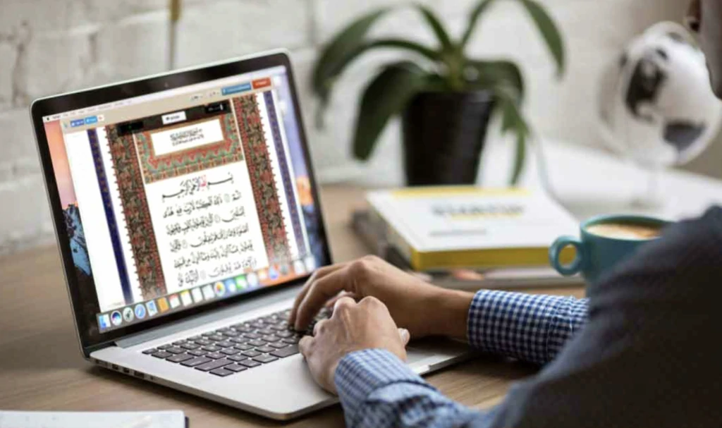 online quran teacher for kids interacting through a laptop screen